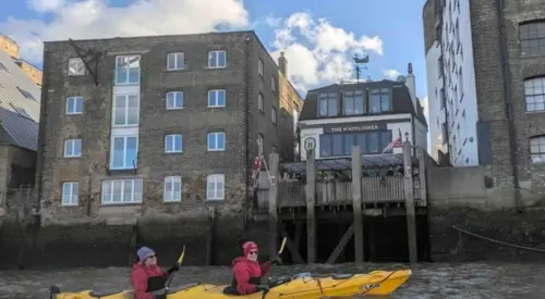 Kayaking by a pub